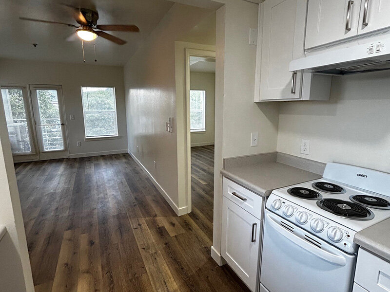 Kitchen with Stove and Diswasher with Entrance to Living Room | Riverside