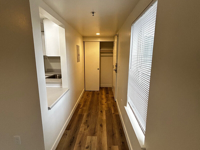 Hallway with Open Closet and Window | Riverside