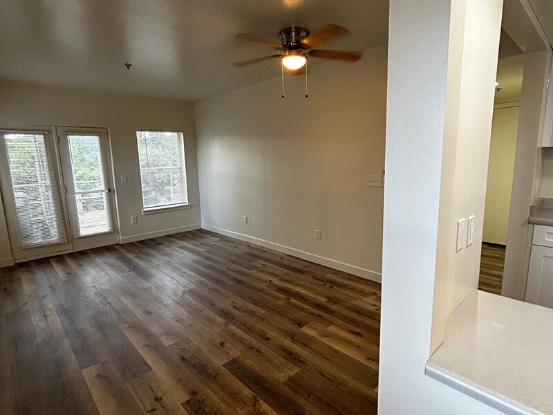 Living Room with Wood Style Floors and Ceiling Light | Riverside
