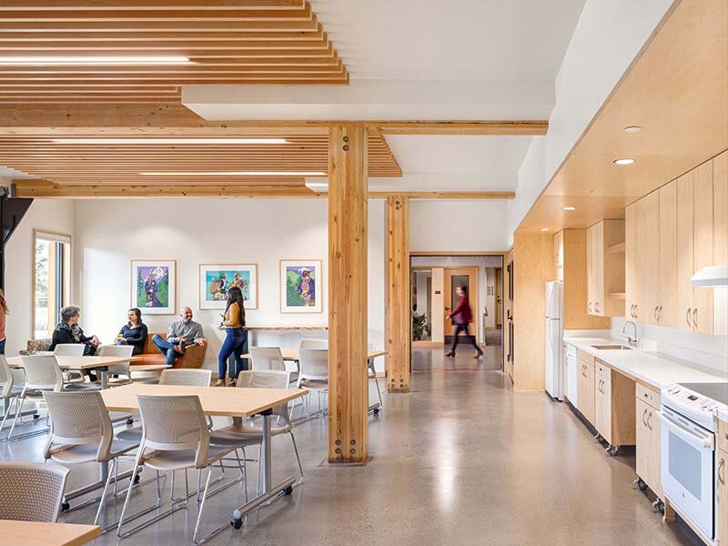 Community Seating with Kitchen and Wood Style Cabinets | Nesika Illahee