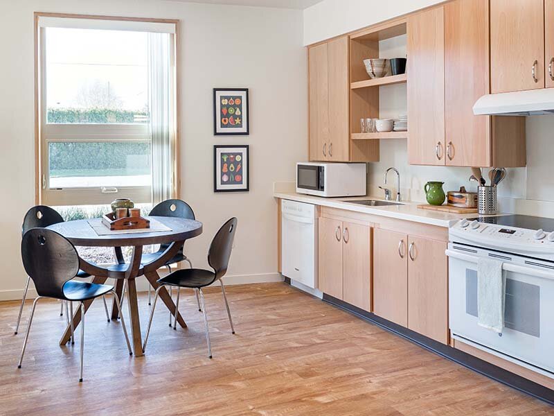 Kitchen with Window and Dining Room Table | Nesika Illahee
