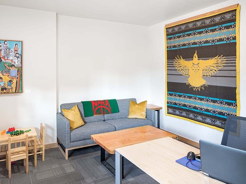 Living Room with Couch and Hanging Wall Art | Nesika Illahee