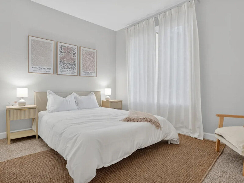 Bedroom with Windows and Carpeted Flooring and Wall Art | Pacific Shores