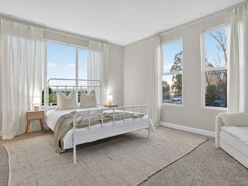 Bedroom with Open Windows and Carpeted Flooring | Pacific Shores
