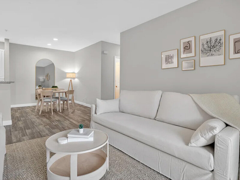 Living Room with Carpeted Flooring and Wall Art | Pacific Shores