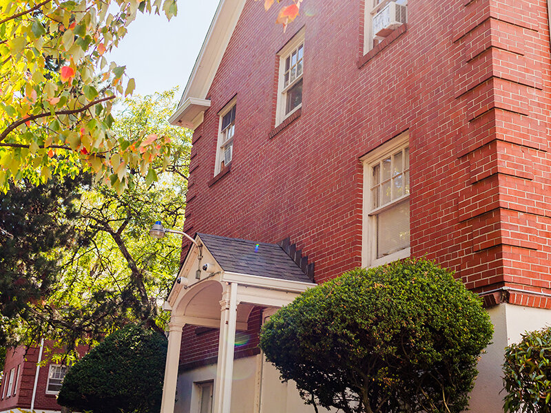 Apartment Entrance with Foliage and Trees | Milepost 5