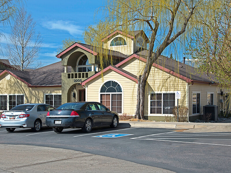 Exterior Views of Apartment Complex with Apartment Parking | The Willows at Printers Park Apartments