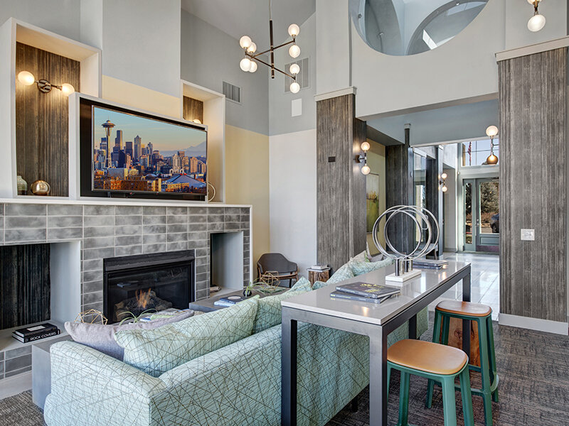 Resident Lounge with Media and Fireplace | The Willows at Printers Park Apartments