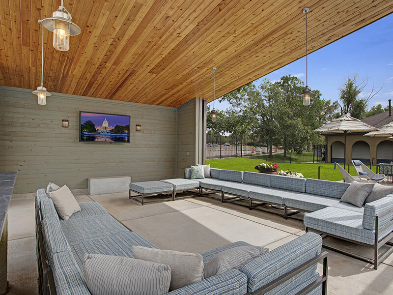 Apartment Complex Outdoor Lounge with Television | The Willows at Printers Park Apartments