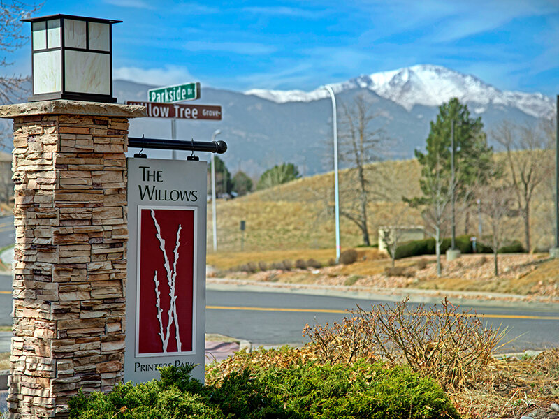 Exterior View of Monument Sign | The Willows at Printers Park Apartments