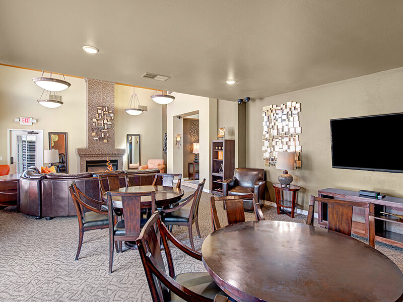 Community Seating with Dining Tables and Television | The Willows at Printers Park Apartments