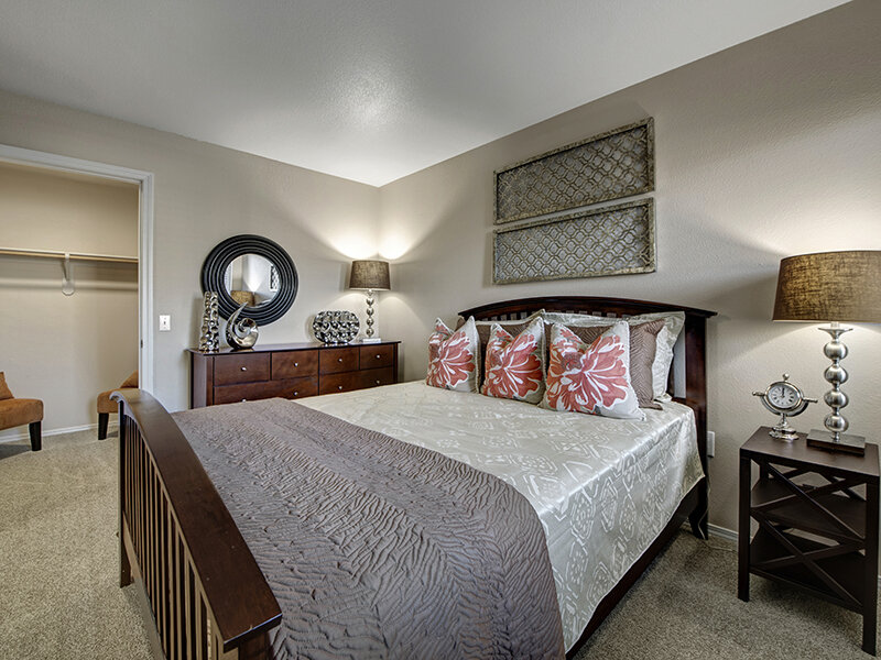 Apartment Bedroom with Lamp and Carpeted Flooring | The Willows at Printers Park Apartments