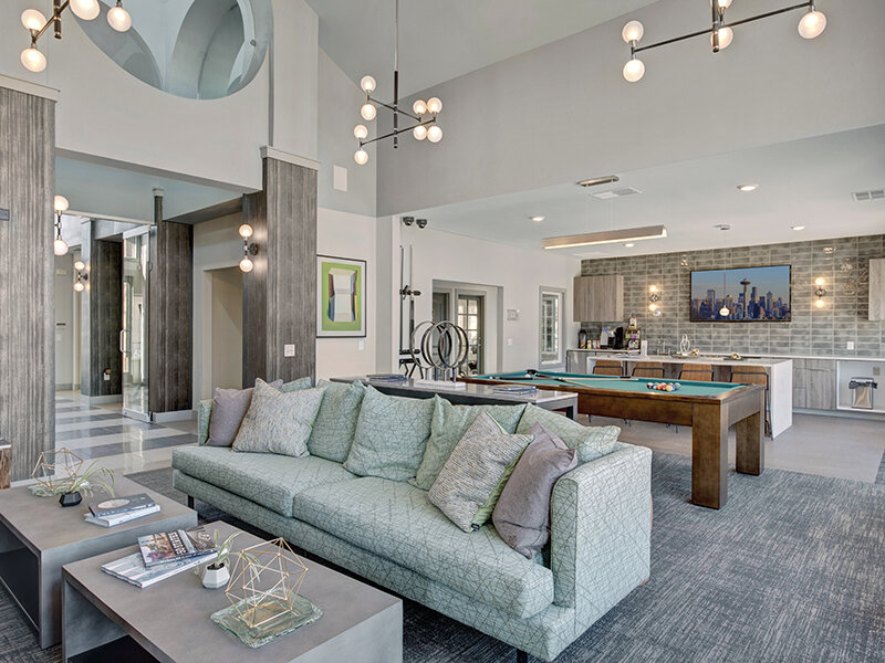 Community Clubhouse with Sofas and Pool Table | The Willows at Printers Park Apartments