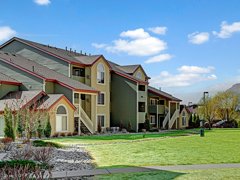 Exterior View of Apartment Property with Sidewalk and Foliage | The Willows at Printers Park Apartments