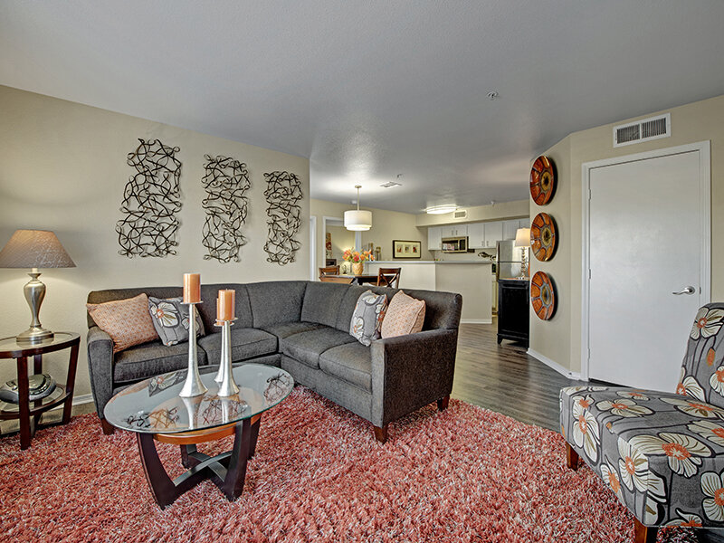 Living Room with Coffee Table and Entrance to Kitchen | The Willows at Printers Park Apartments