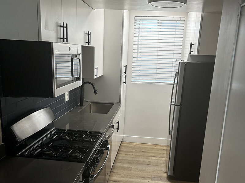 Kitchen with Black Appliances | Ellis Midtown