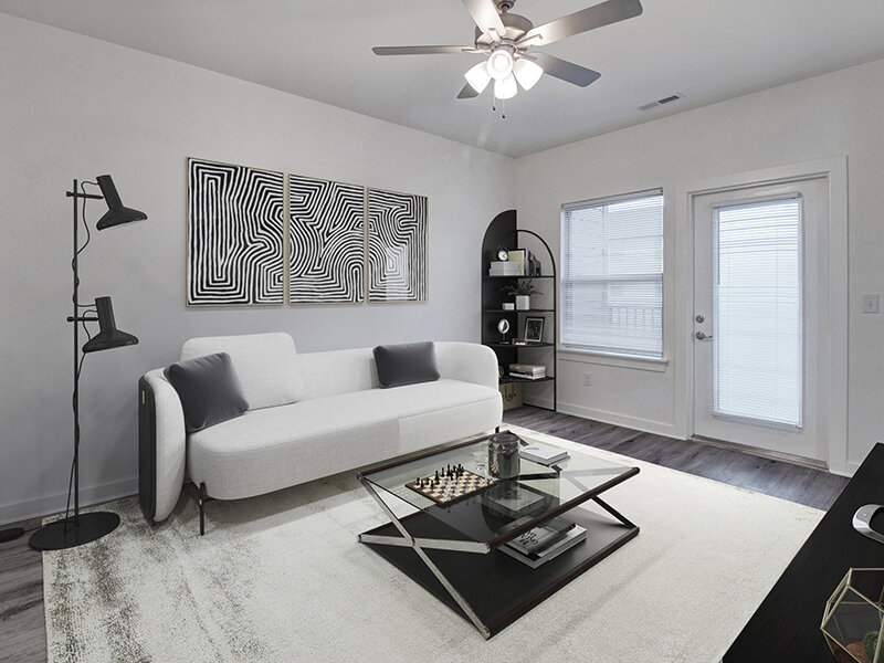 Living Room with Ceiling Fan and Wall Art | Merchants Walk