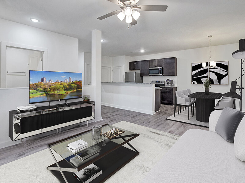 Living Room with Television and Ceiling Fan | Merchants Walk