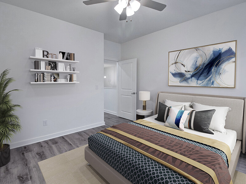 Bedroom with Ceiling Fan and Wall Art | Merchants Walk