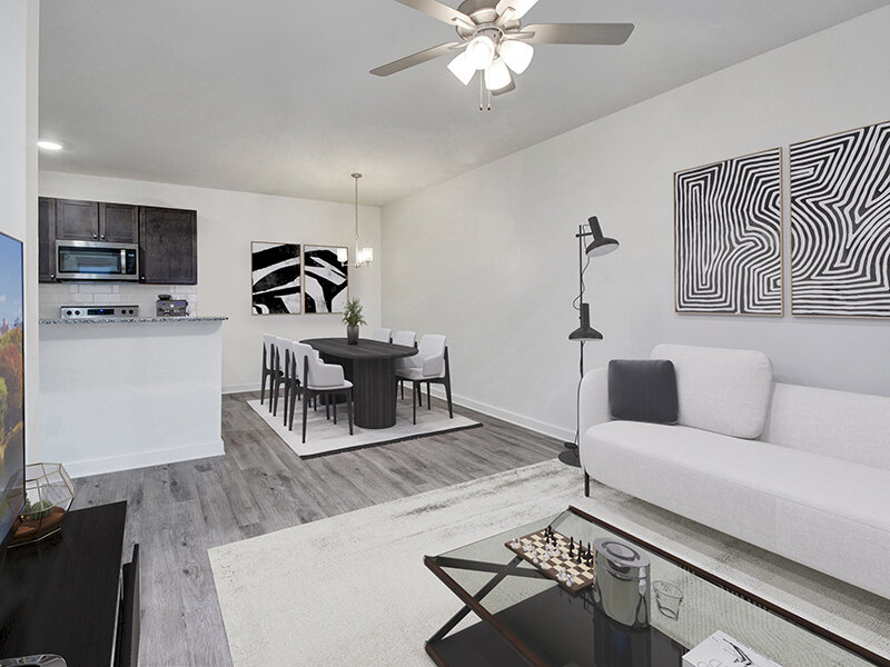 Living Room Area with Wall Art and Rug | Merchants Walk