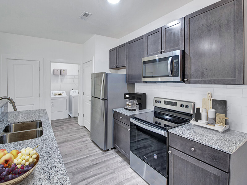 Kitchen with Wood Style Flooring and Ceiling Light | Merchants Walk