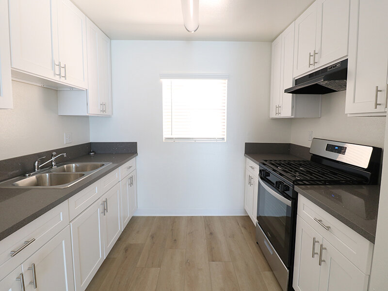 Kitchen with Window and Wood Style Flooring | Bella Vista