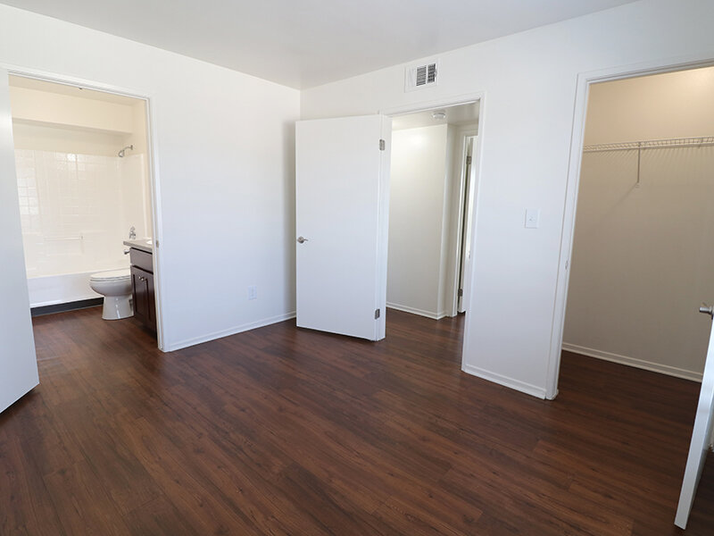 Bedroom with Open Closet and Wood Style Flooring | Bella Vista