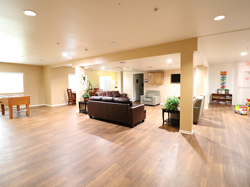Community Clubhouse with Seating and Wood Style Flooring | Bella Vista