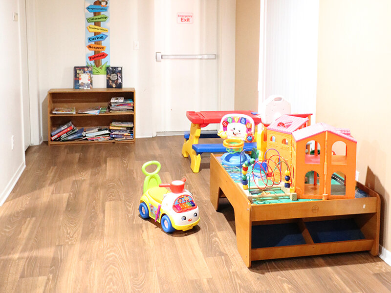 Bedroom with Playset and Wood Style Flooring | Bella Vista