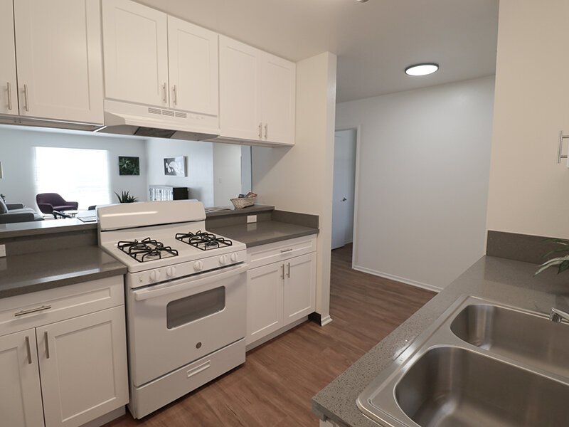 Kitchen with Wood Style Flooring and Kitchen Sink | Bella Vista