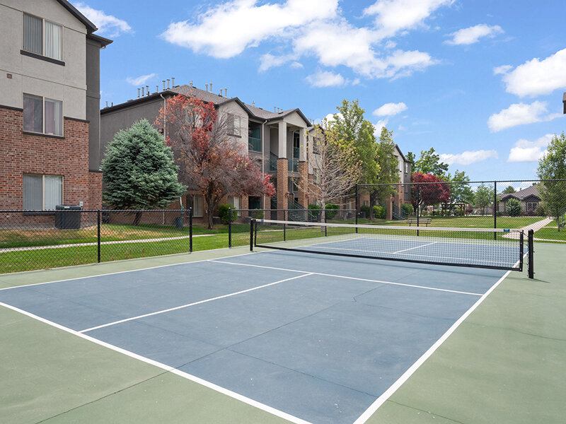 Apartment Outdoor Tennis Court with Foliage | Pleasant Springs