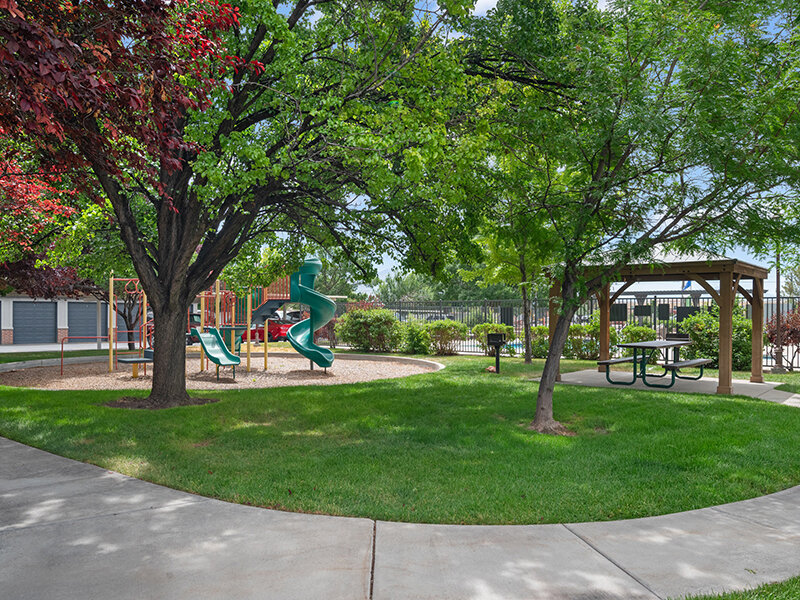 Exterior Views of Apartment Complex with Playground and Sidewalk | Pleasant Springs