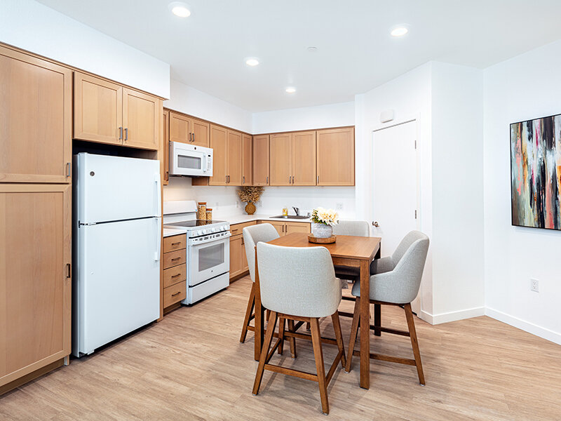 Kitchen with Dining Room Table and Wood Style Flooring | View at Blossom Hill
