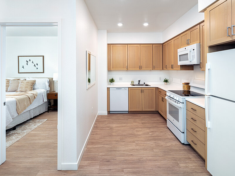 Kitchen with Appliances and Wood Style Flooring | View at Blossom Hill