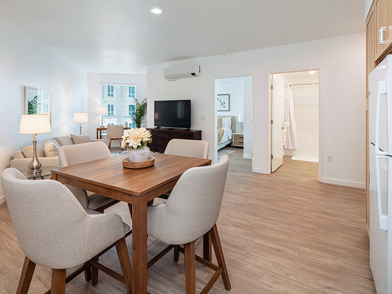 Dining Room Table with Television and Window | View at Blossom Hill