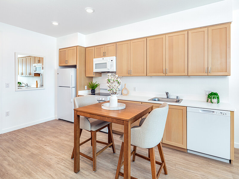 Seating Area in Kitchen with Wood Style Flooring | View at Blossom Hill