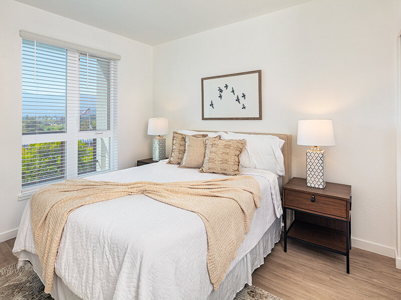Bedroom with Wood Style Flooring and Wall Art | View at Blossom Hill