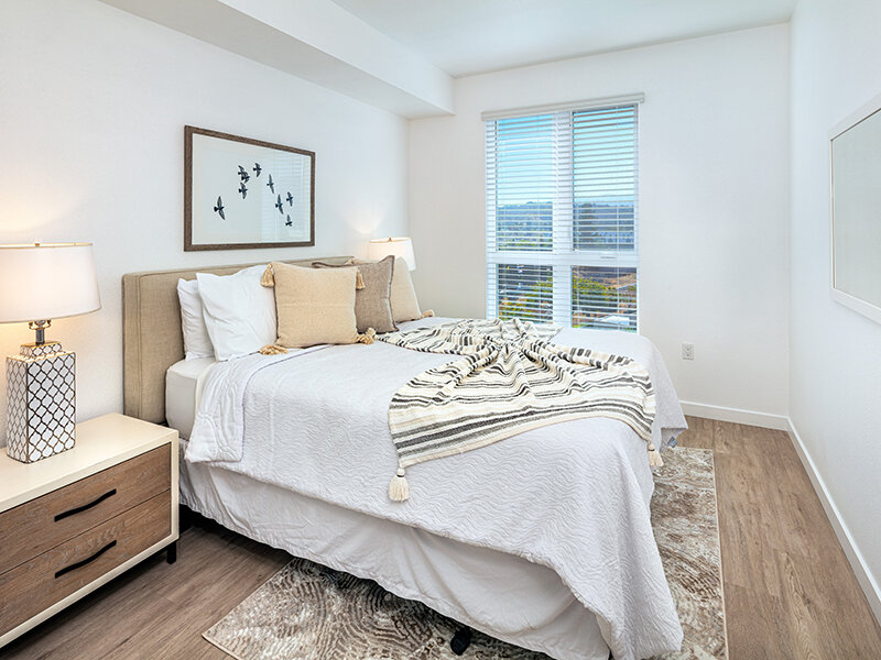 Bedroom with Window with Wood Style Flooring | View at Blossom Hill