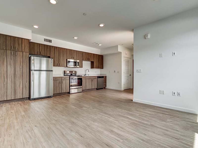 Kitchen with Ceiling Lights and Wood Styled Flooring | Ageno Affordable