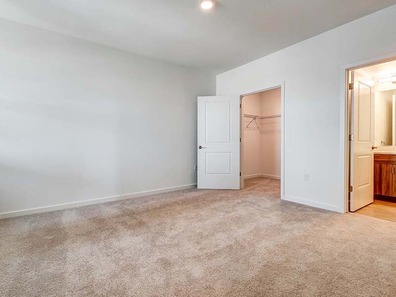 Bedroom with Open Closet and Ceiling Light | Ageno Affordable