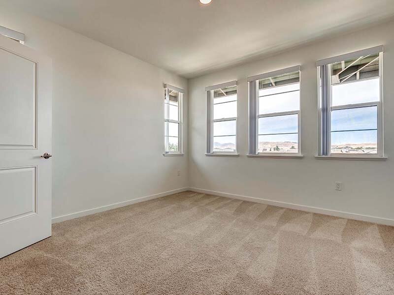 Apartment Bedroom with Carpeted Floors and Windows | Ageno Affordable