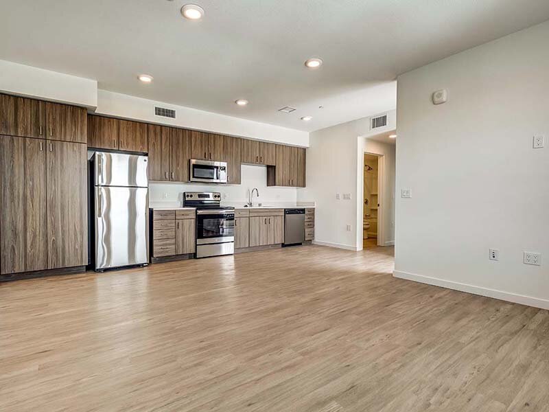 Kitchen with Lights and Wood Styled Floors | Ageno Affordable