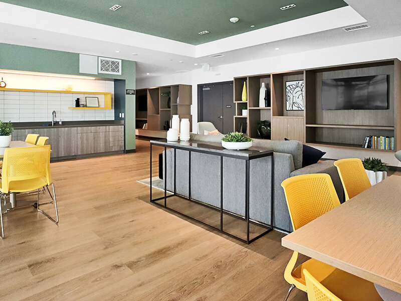 Community Seating with Ceiling Lights and Wood Style Flooring | Mission Gateway