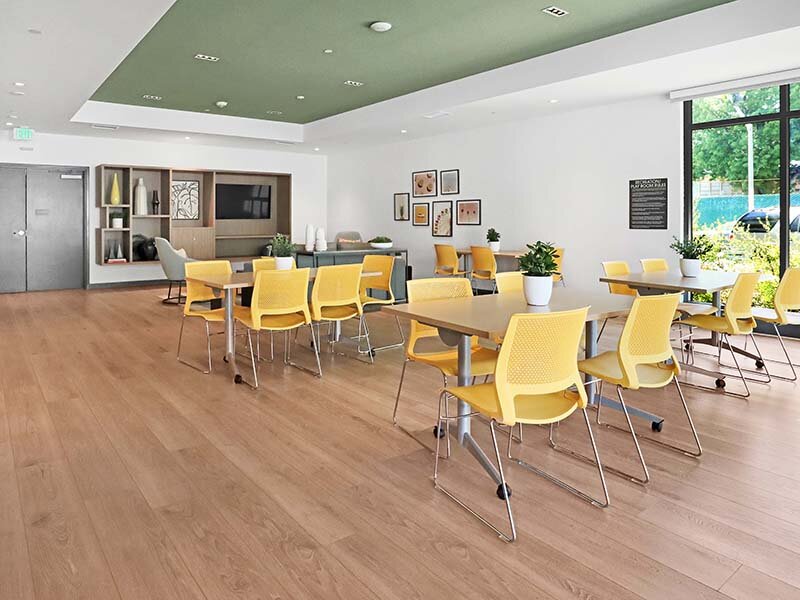 Community Seating with Ceiling Light and Wood Style Flooring | Mission Gateway