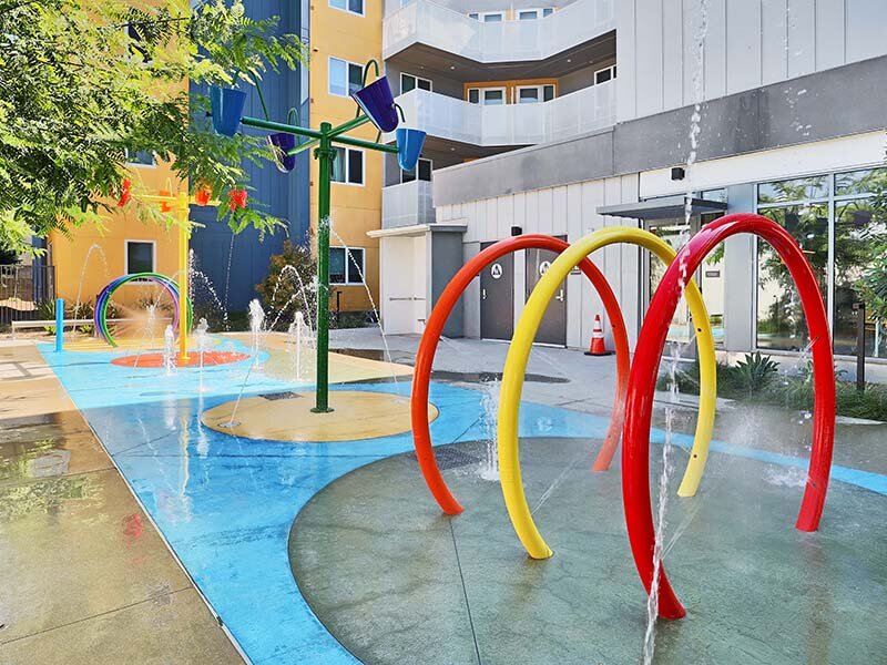 Exterior View of Splash Pad and Apartment Complex | Mission Gateway