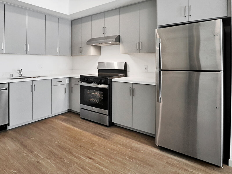 Kitchen with Stove and Wood Style Flooring | Mission Gateway