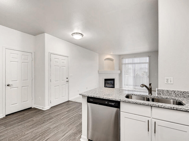 Kitchen and Living Room with Fireplace | Allure Apartments