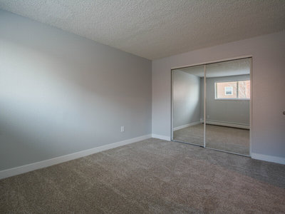 Bedroom with Mirrored Closet | The Reserve at Water Tower Village