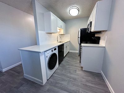 Kitchen with Washer/Dryer | The Reserve at Water Tower Village