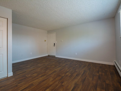 Front Room with Wood Style Flooring | The Reserve at Water Tower Village